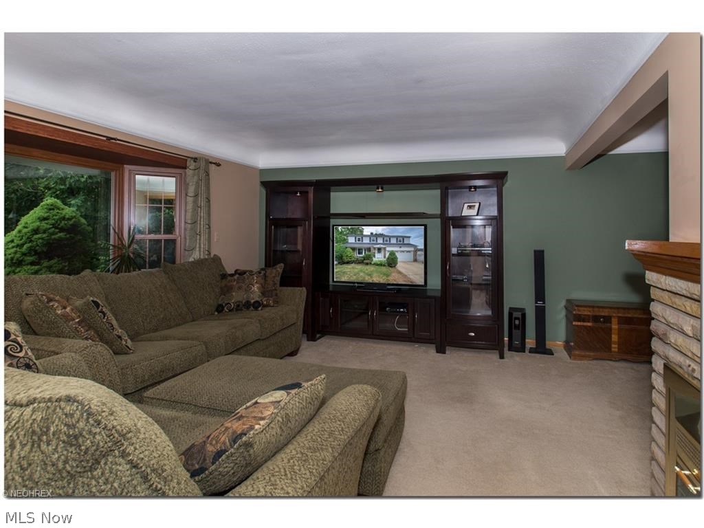 1443 Clearview Road Cleveland, OH 44124 - Photo 3 of 19 Living Room with bay window, stone fireplace. Neutral tones are the perfect "blank slate" for your furniture and artwork.