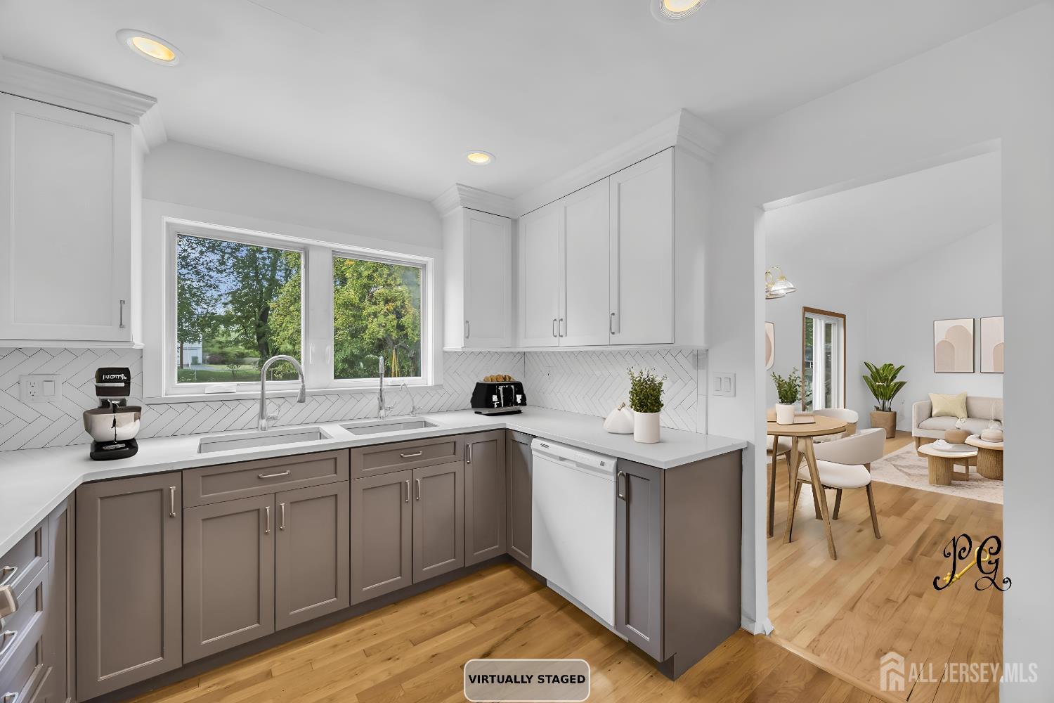 23 Barlow Road Edison, NJ 08817 - Photo 16 of 50 a kitchen with a sink window and cabinets