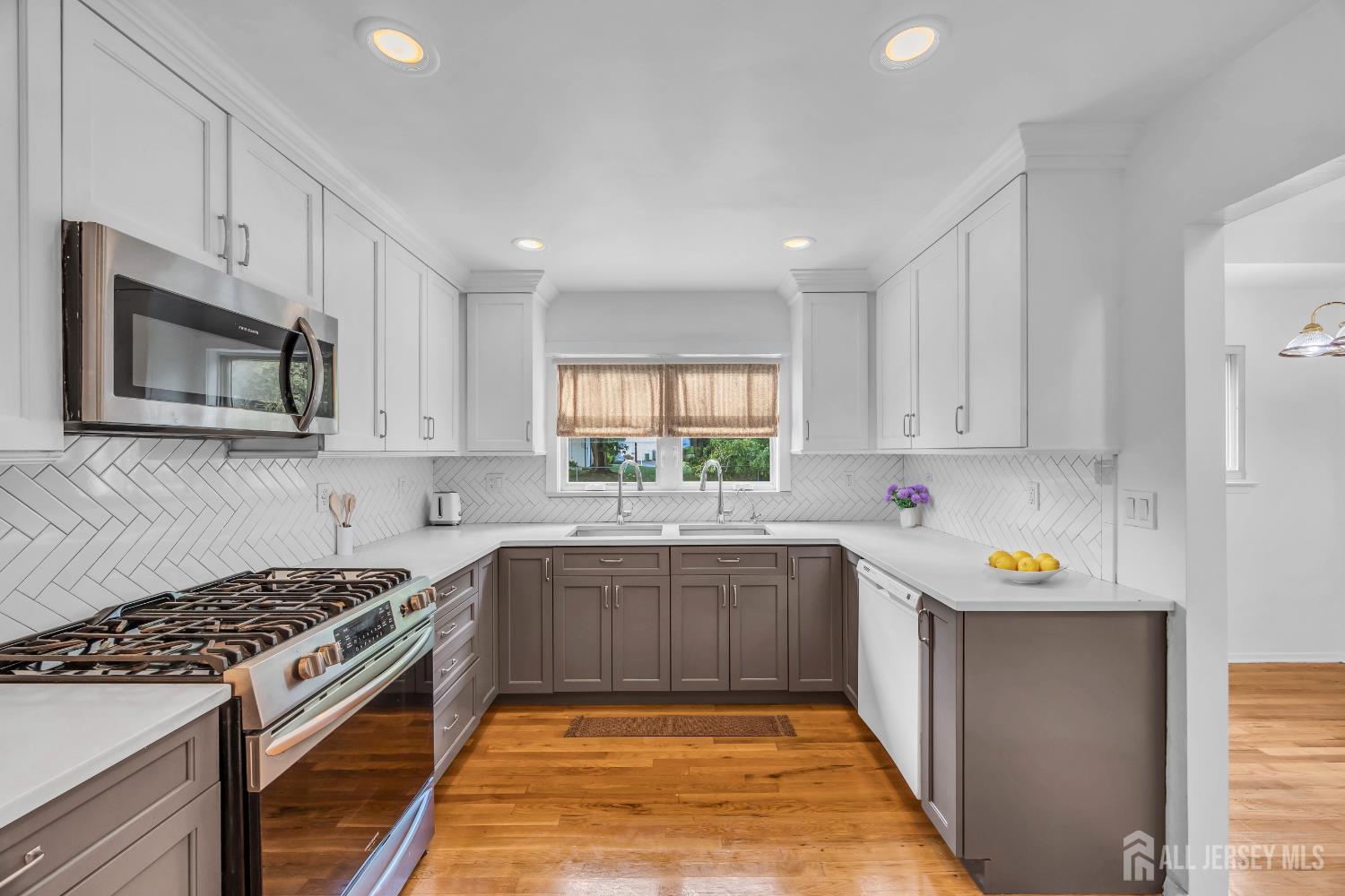 23 Barlow Road Edison, NJ 08817 - Photo 17 of 50 a kitchen with a sink stove top oven and microwave