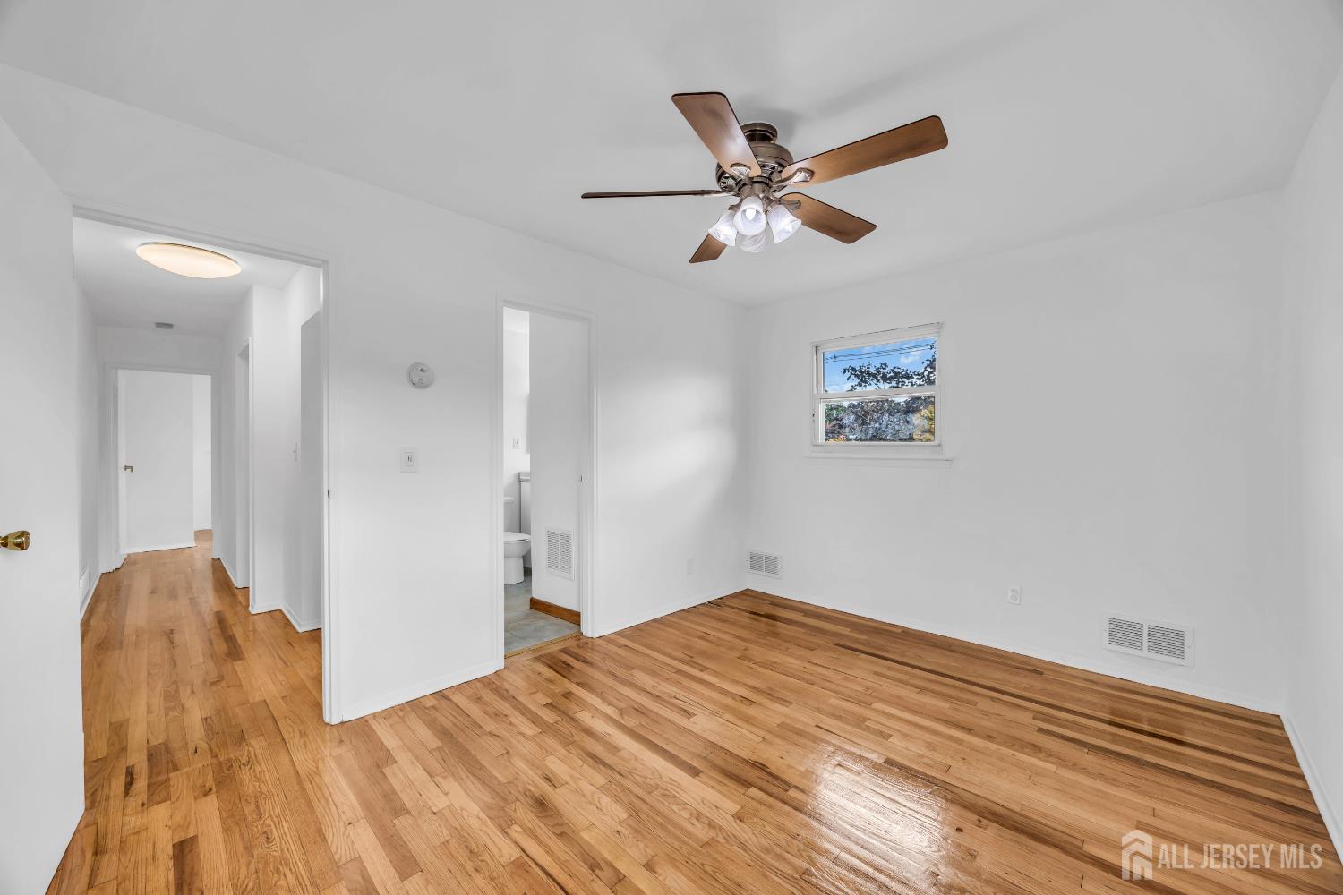 23 Barlow Road Edison, NJ 08817 - Photo 29 of 50 a bedroom with a bed and a chandelier