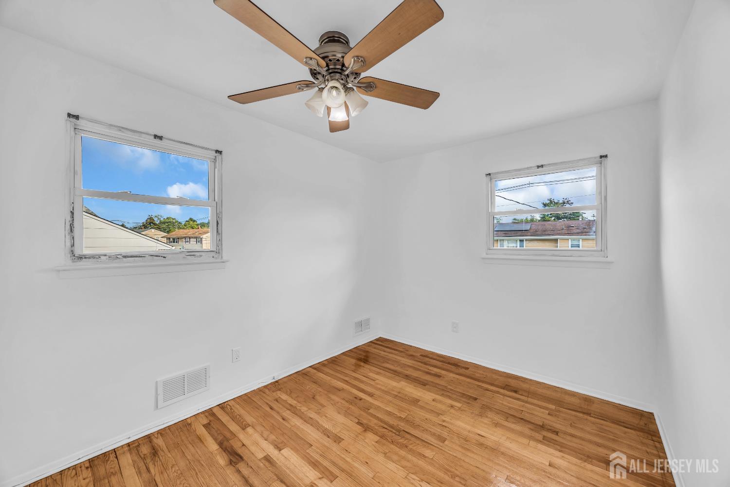 23 Barlow Road Edison, NJ 08817 - Photo 32 of 50 a view of empty room with wooden floor