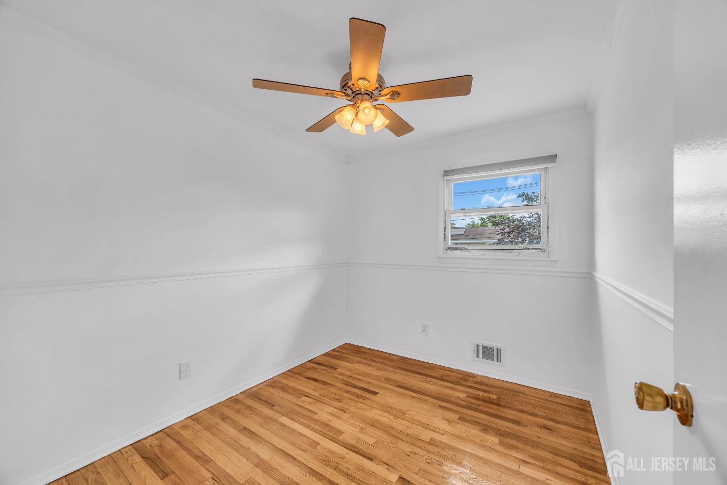 23 Barlow Road Edison, NJ 08817 - Photo 34 of 50 a bedroom with a bed and a chandelier