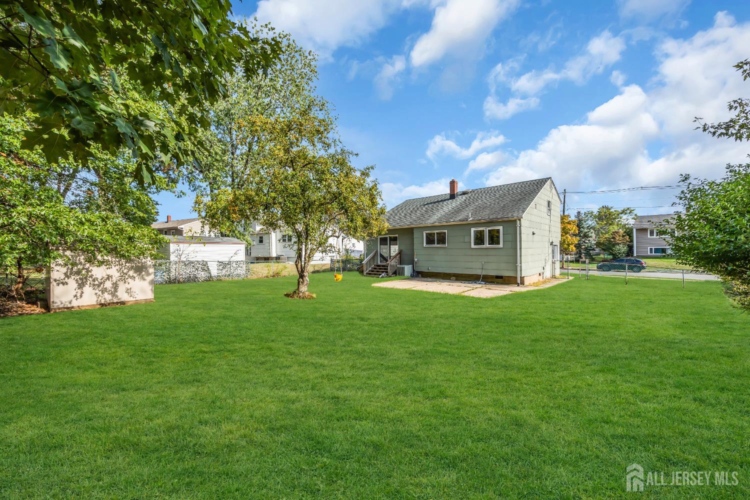 23 Barlow Road Edison, NJ 08817 - Photo 38 of 50 a view of a house with a backyard