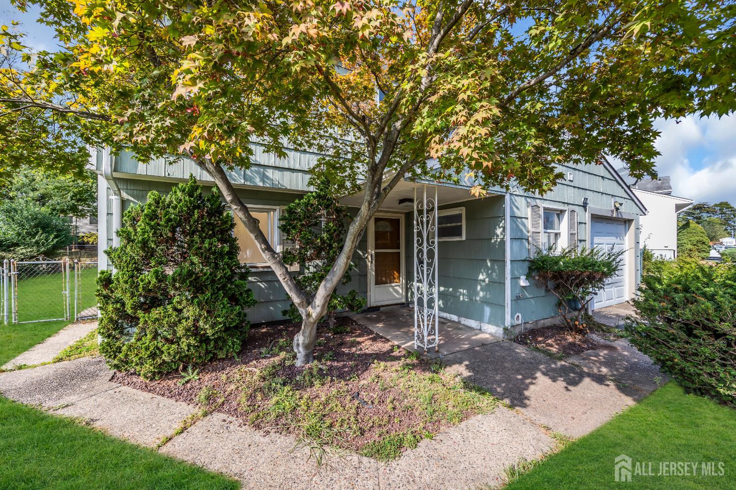 23 Barlow Road Edison, NJ 08817 - Photo 4 of 50 a front view of a house with garden