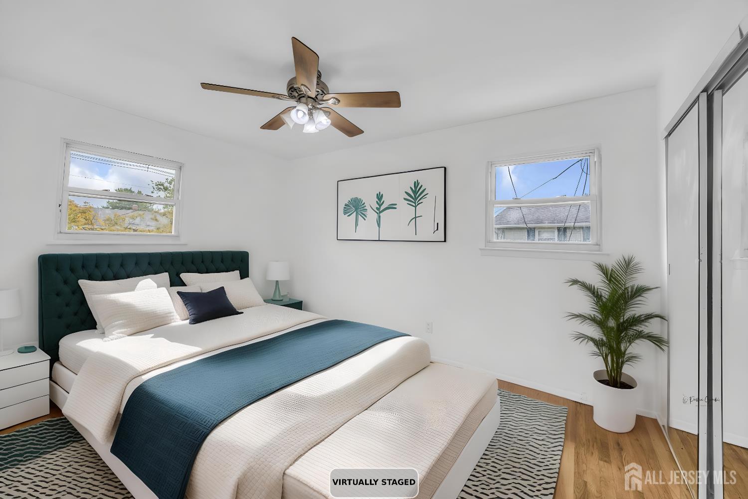 23 Barlow Road Edison, NJ 08817 - Photo 41 of 50 a bedroom with bed and a potted plant