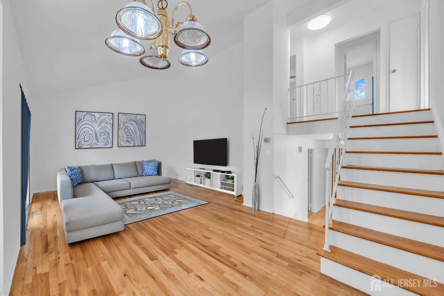 23 Barlow Road Edison, NJ 08817 - Photo 49 of 50 a living room with furniture and a flat screen tv
