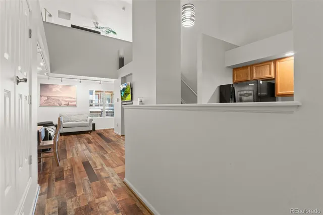 a view of a living room with furniture and a window