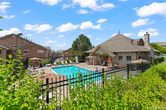 a front view of a house with garden and patio