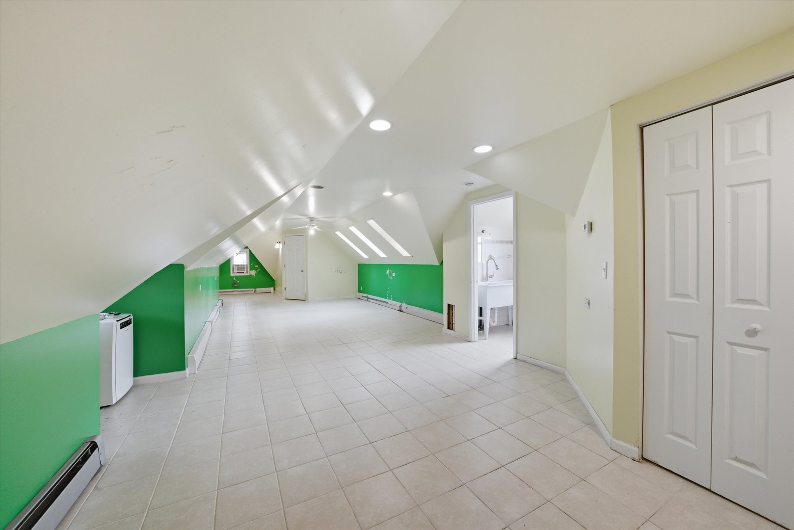 3100 Clinton Avenue Berwyn, IL 60402 - Photo 14 of 25 a view of a hallway with yellow lighting