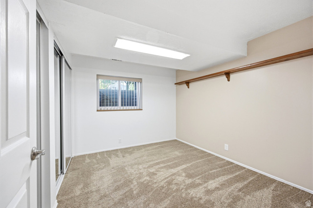 734 Sandy Dunes Drive Sandy, UT 84094 - Photo 25 of 36 Bedroom adjacent to the basement flex room creating a great basement apartment with his and hers closets.