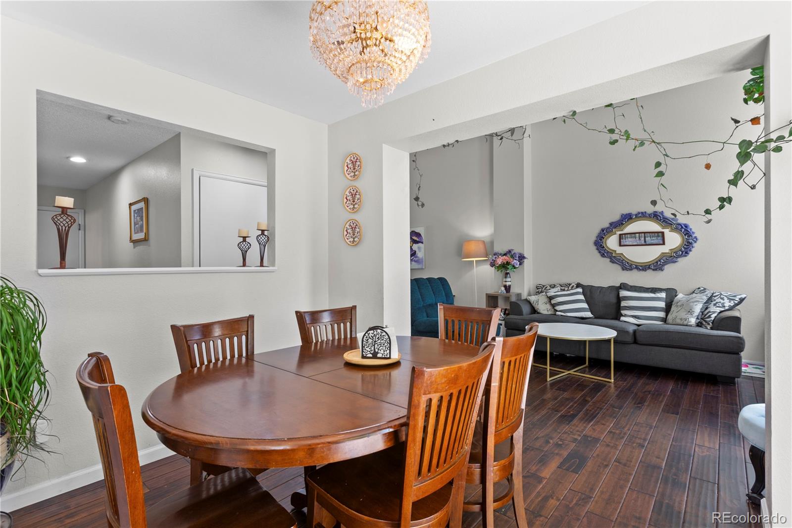 2212 Hyacinth Road Littleton, CO 80129 - Photo 13 of 44 a view of a dining room with furniture and wooden floor