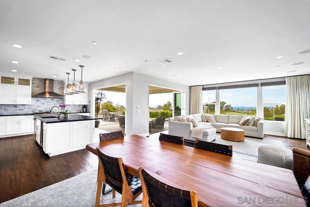 896 Channel Island Drive Encinitas, CA 92024 - Photo 11 of 51 a living room with kitchen island furniture and a large window