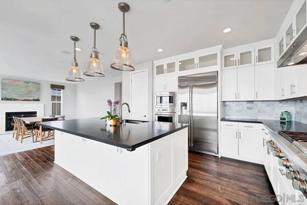 896 Channel Island Drive Encinitas, CA 92024 - Photo 15 of 51 a kitchen with stainless steel appliances granite countertop a sink a stove and a wooden floors