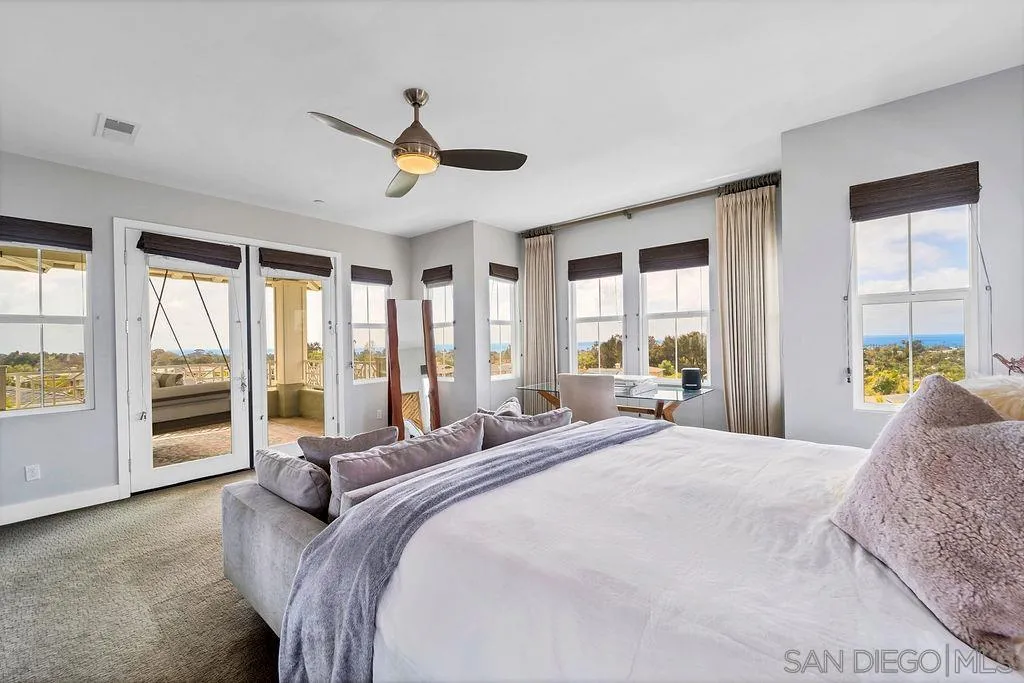 896 Channel Island Drive Encinitas, CA 92024 - Photo 16 of 51 a bedroom with a large bed and a large window