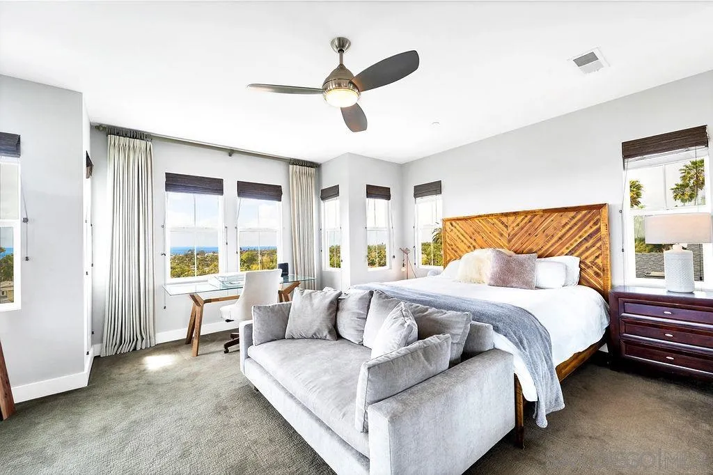 896 Channel Island Drive Encinitas, CA 92024 - Photo 17 of 51 a spacious bedroom with a bed and a large window