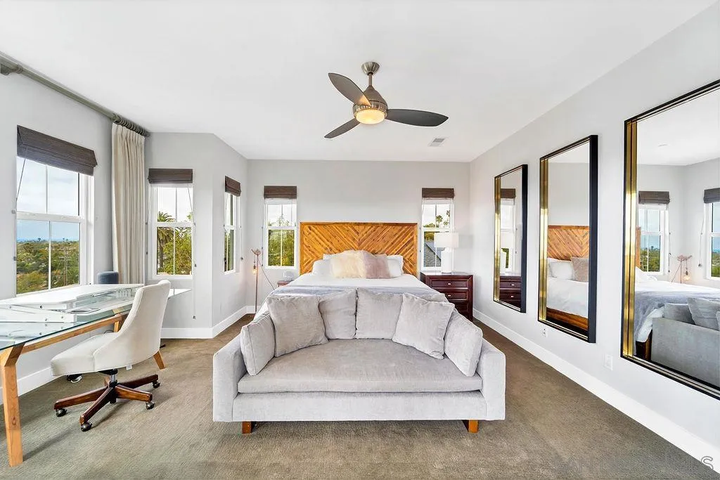 896 Channel Island Drive Encinitas, CA 92024 - Photo 18 of 51 a spacious bedroom with a bed couch and a large window