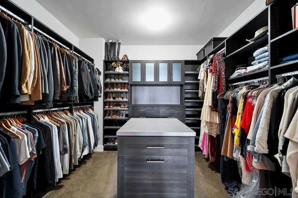 896 Channel Island Drive Encinitas, CA 92024 - Photo 25 of 51 a view of walk in closet with clothes and shoes