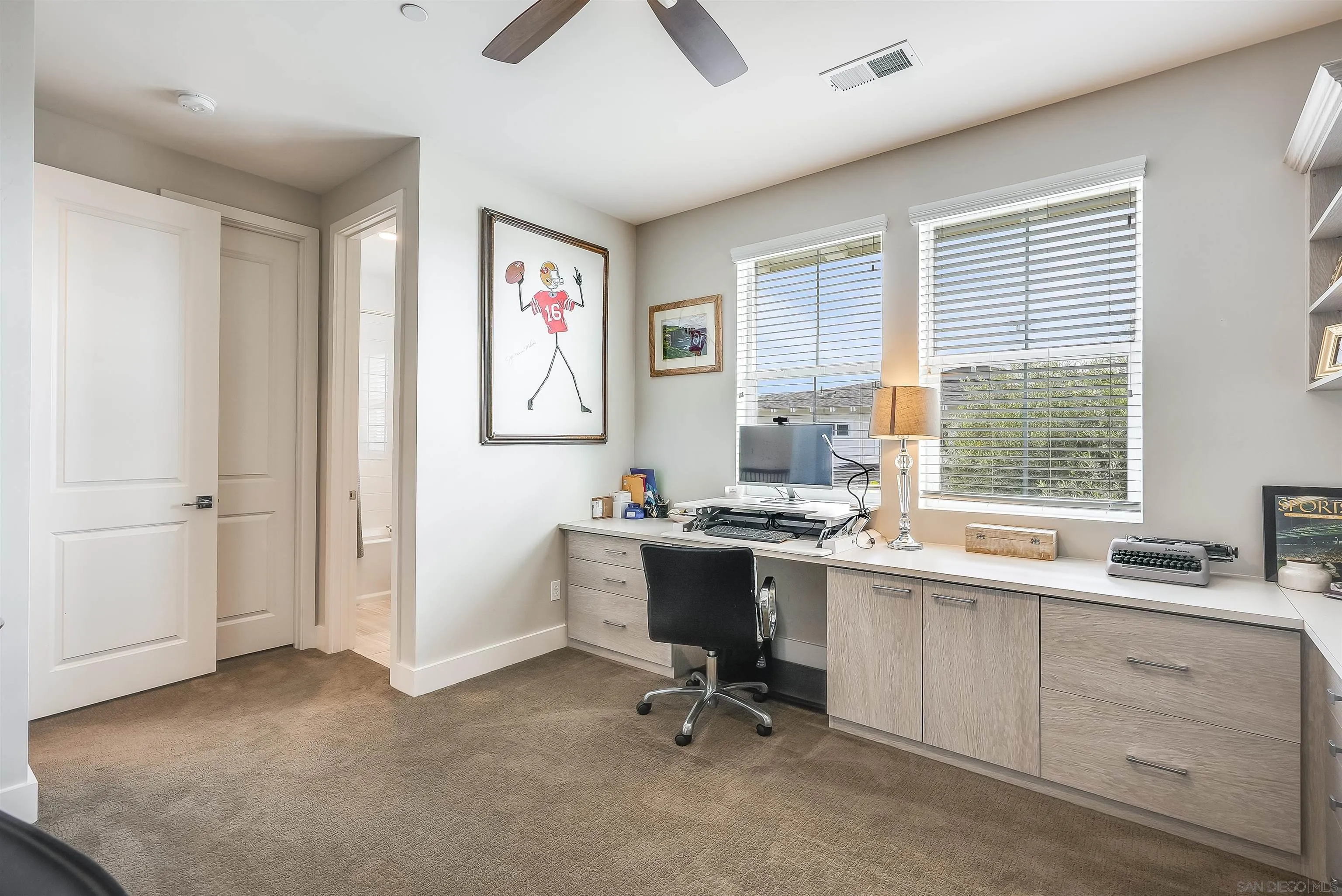 896 Channel Island Drive Encinitas, CA 92024 - Photo 31 of 51 a view of a workspace with furniture and a window