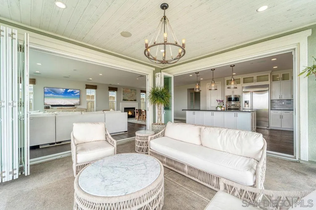 896 Channel Island Drive Encinitas, CA 92024 - Photo 42 of 51 a living room with a couch and chandelier