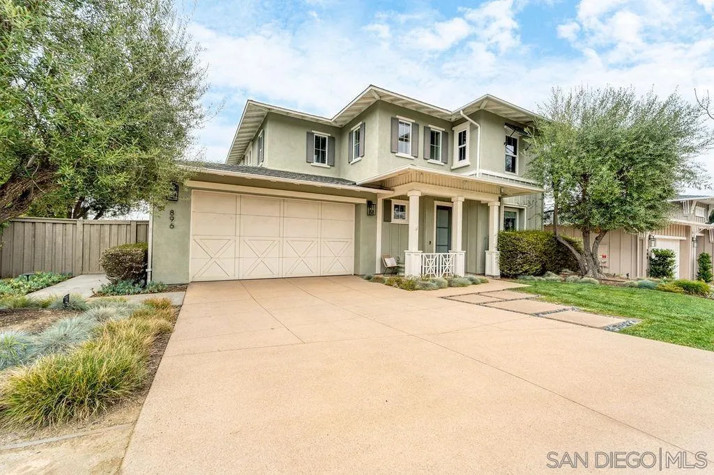 896 Channel Island Drive Encinitas, CA 92024 - Photo 47 of 51 a front view of a house with a yard and garage