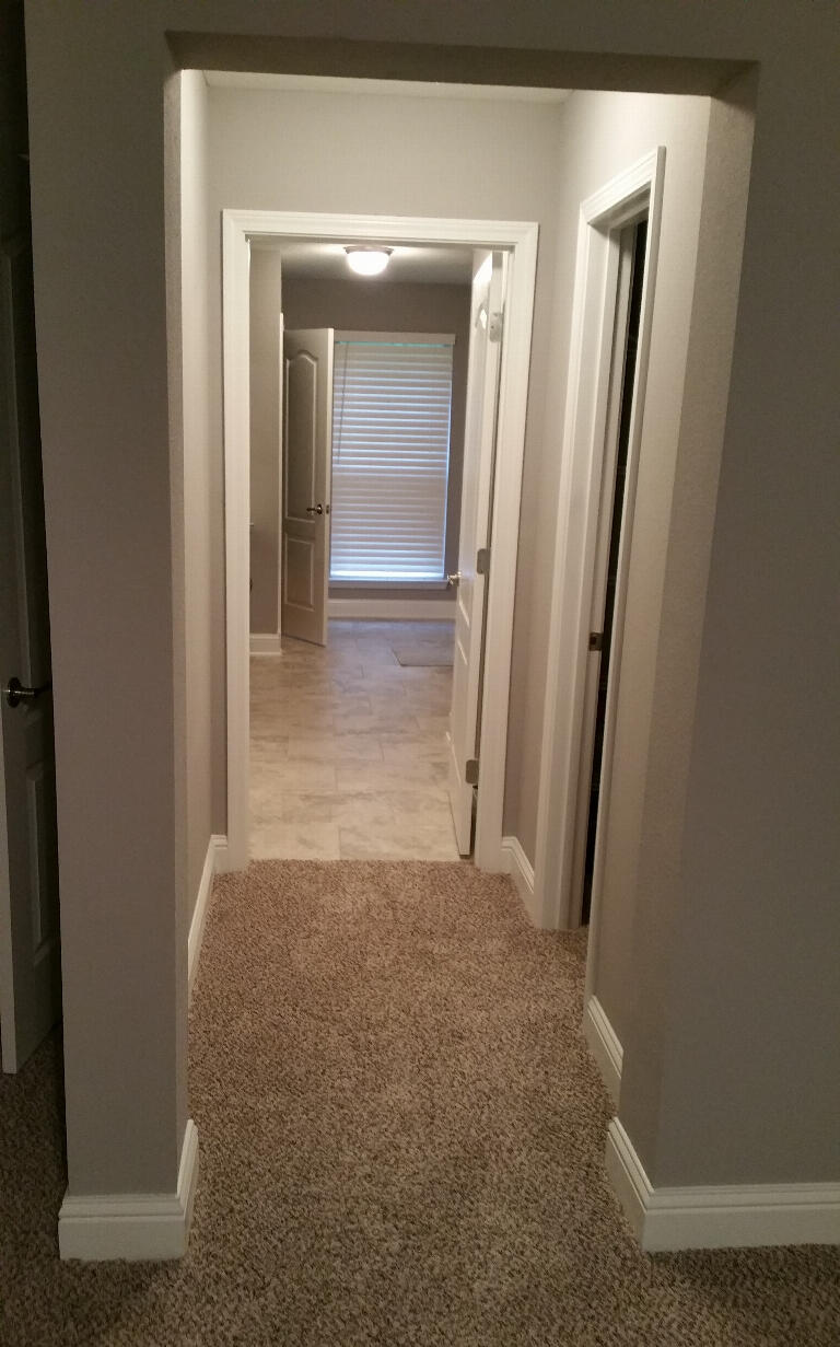 6007 Walk Along Way Crestview, FL 32536 - Photo 16 of 39 a view of a hallway with a door and a window