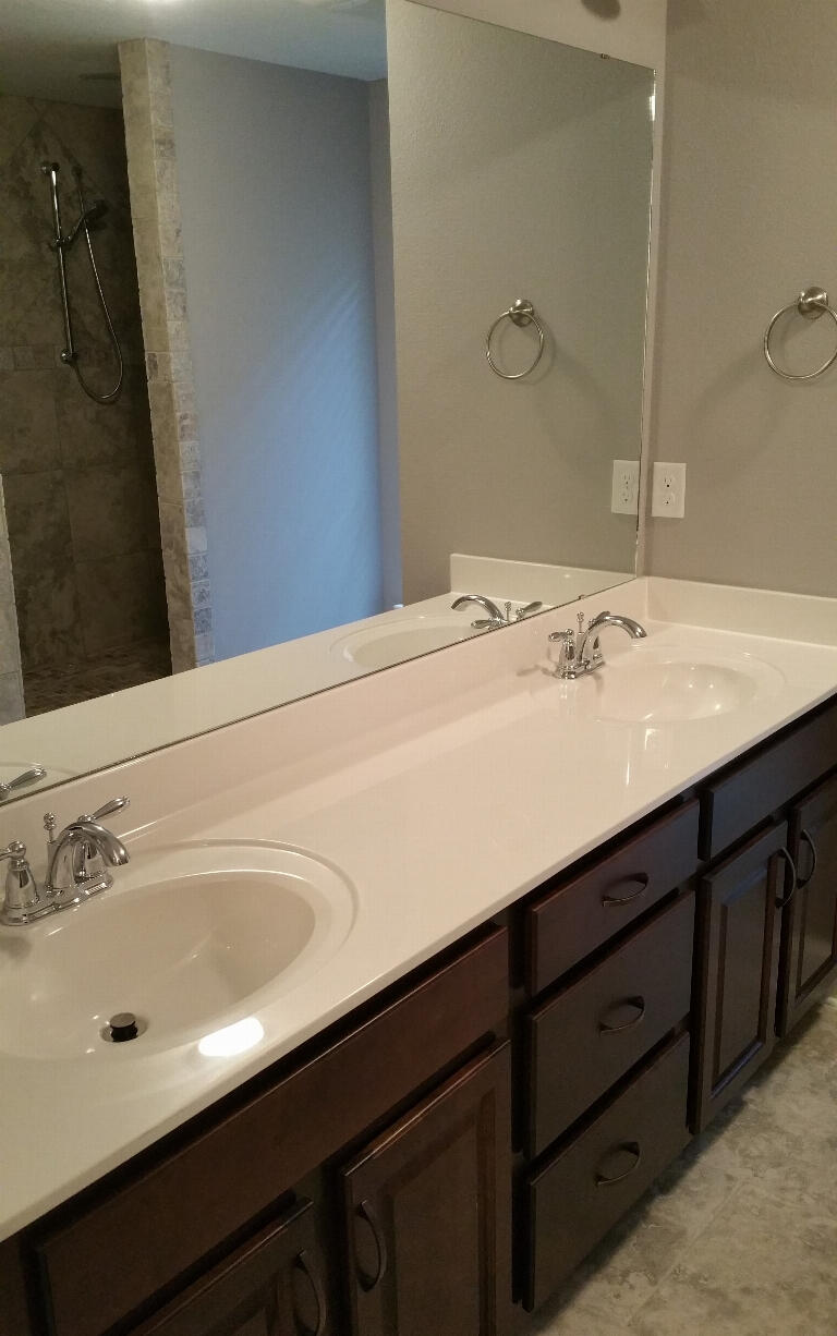 6007 Walk Along Way Crestview, FL 32536 - Photo 22 of 39 a bathroom with a double vanity sink and a mirror