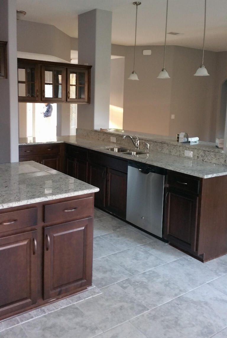 6007 Walk Along Way Crestview, FL 32536 - Photo 9 of 39 a kitchen with granite countertop a sink and a stove