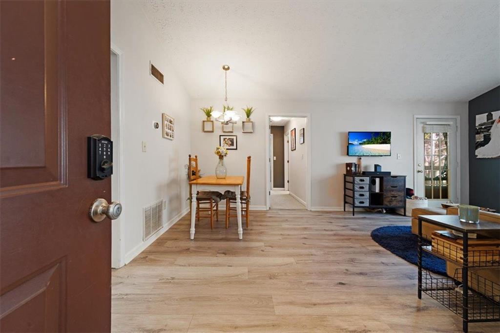 a view of a livingroom with furniture and wooden floor