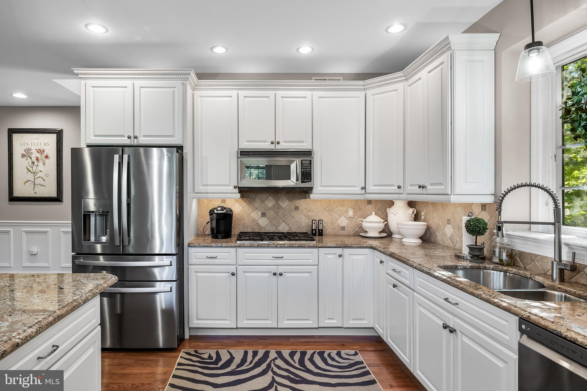 5 Collins Mill Court Moorestown, NJ 08057 - Photo 14 of 49 a kitchen with stainless steel appliances granite countertop a refrigerator sink and cabinets