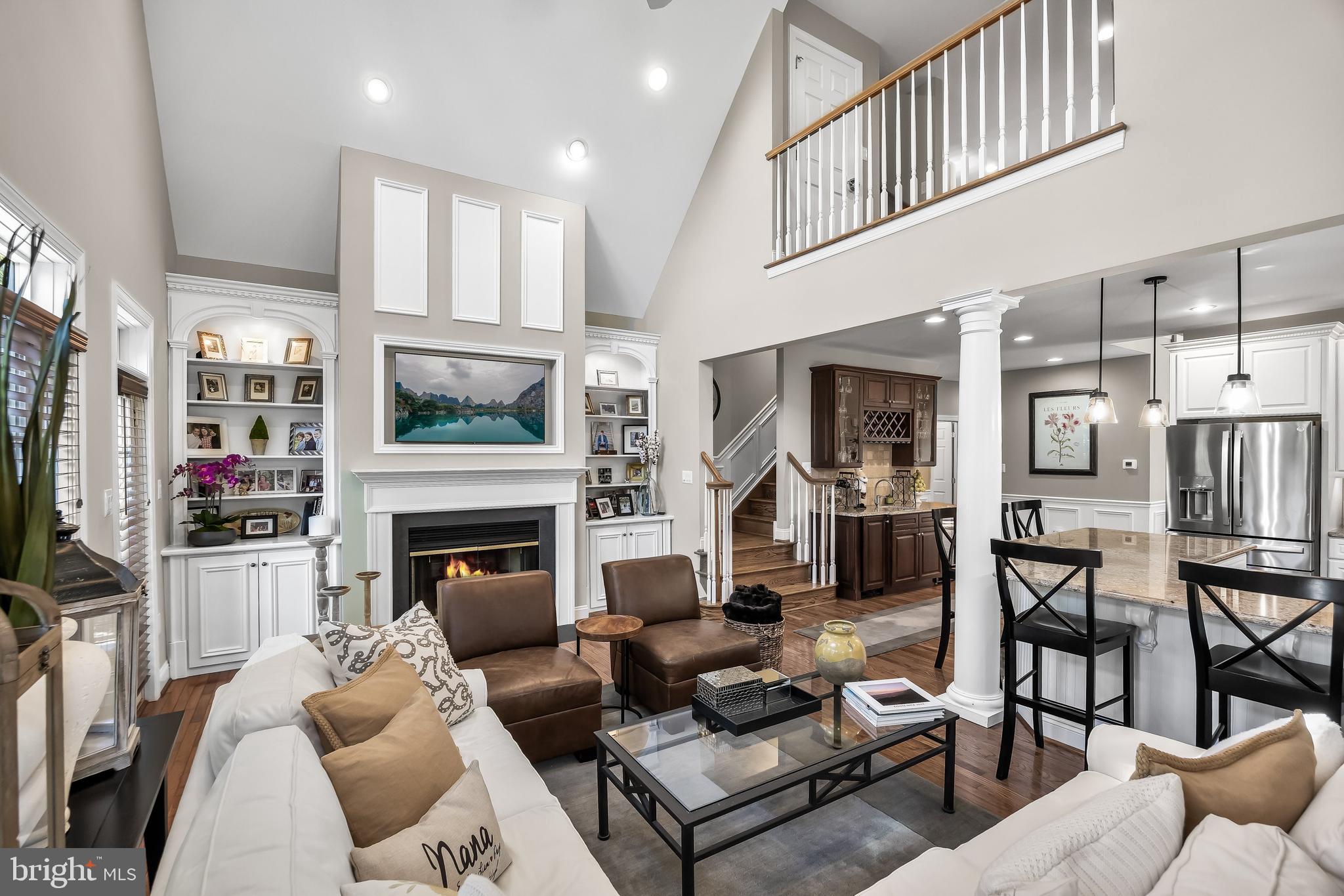 5 Collins Mill Court Moorestown, NJ 08057 - Photo 21 of 49 a living room with furniture a flat screen tv and a fireplace