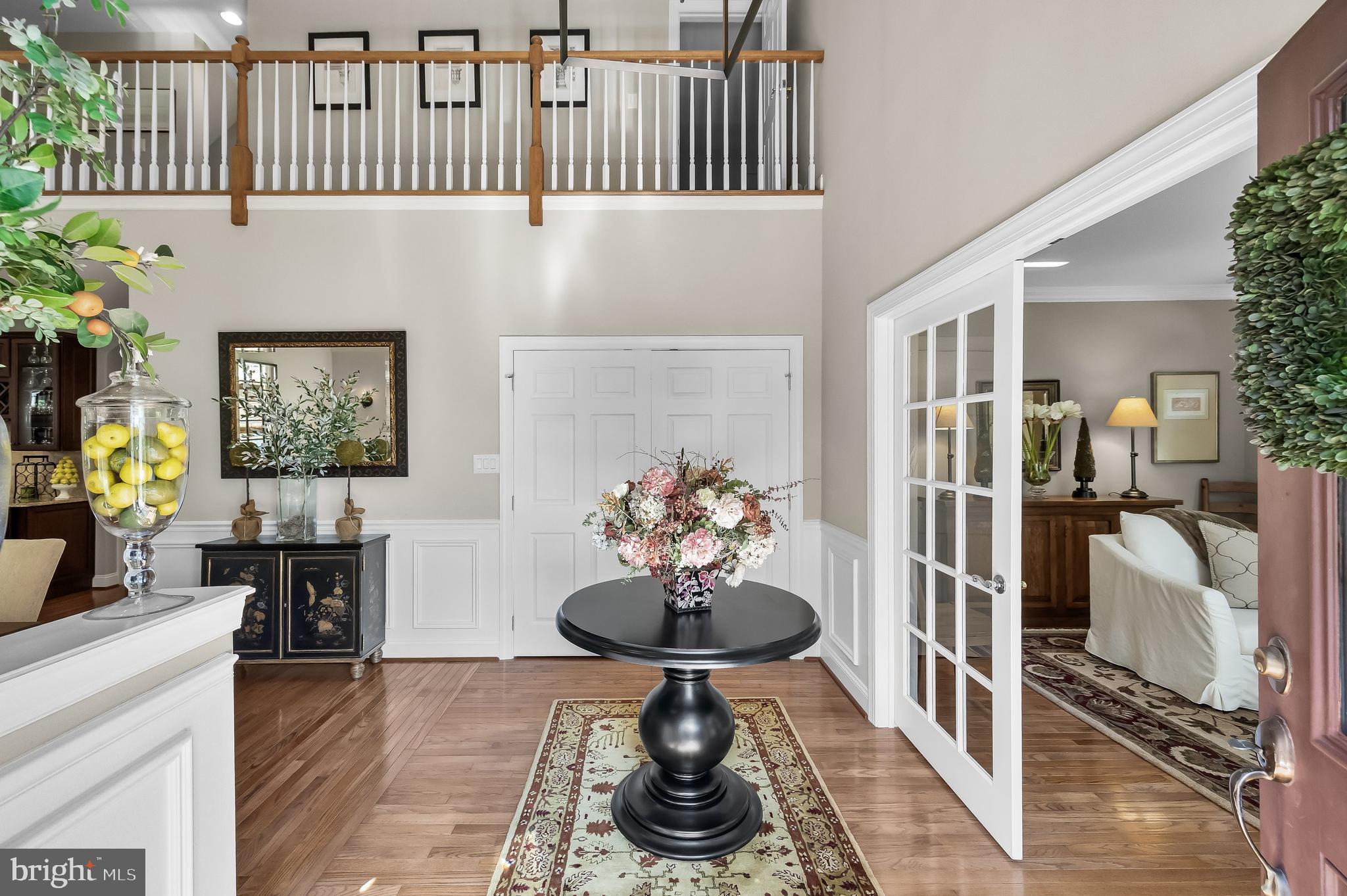 5 Collins Mill Court Moorestown, NJ 08057 - Photo 5 of 49 a vase of flowers sitting on a table in a living room