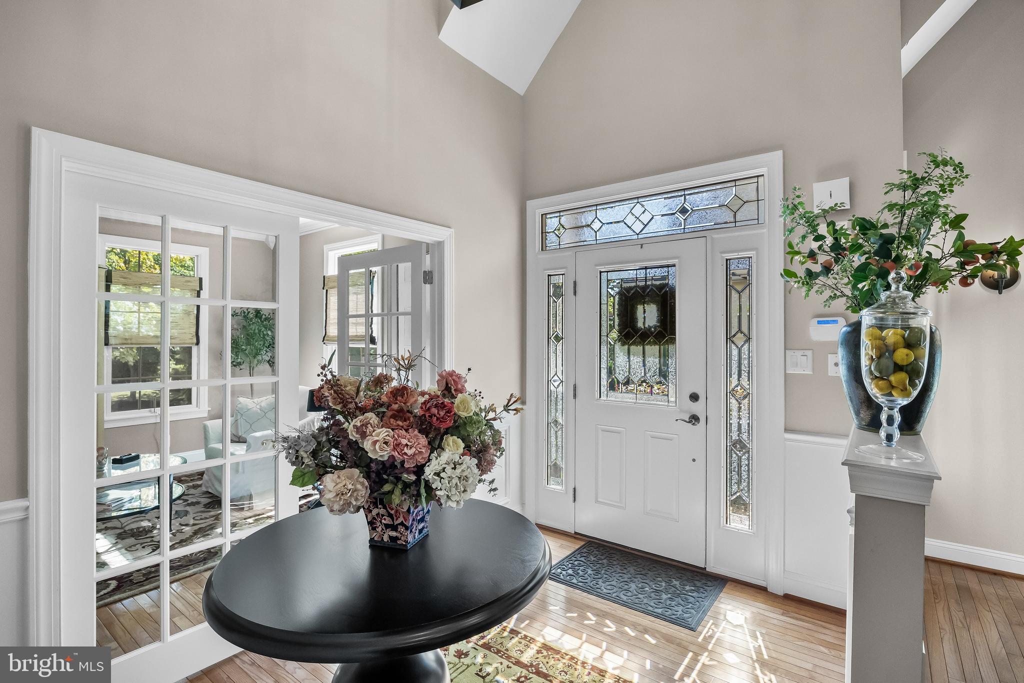 5 Collins Mill Court Moorestown, NJ 08057 - Photo 6 of 49 a view of a hallway with wooden floor and a potted plant