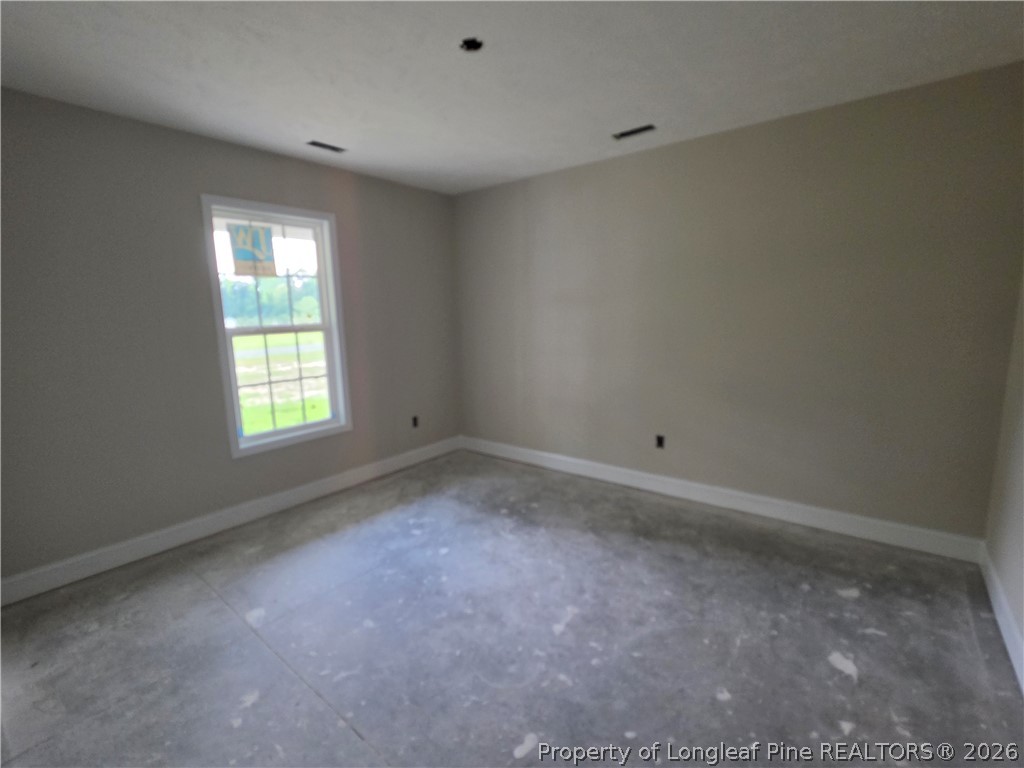 756 Jordan Road Autryville, NC 28318 - Photo 15 of 34 an empty room with a window