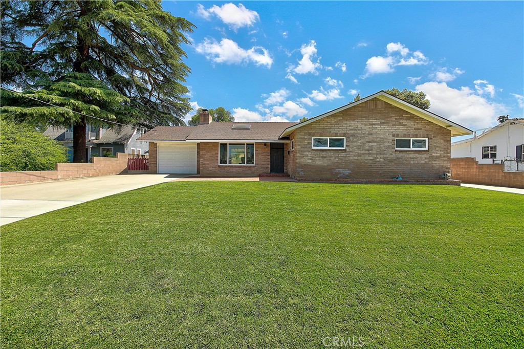 a house view with a garden space