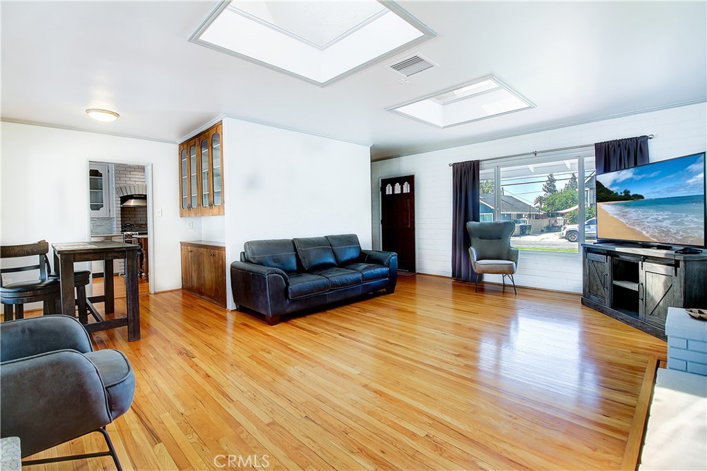4662 Sierra Street Riverside, CA 92504 - Photo 12 of 41 a living room with fireplace furniture and a wooden floor