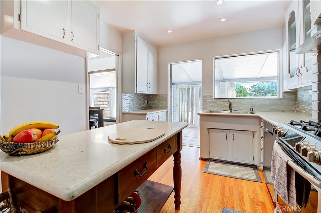 4662 Sierra Street Riverside, CA 92504 - Photo 16 of 41 a kitchen with stainless steel appliances a stove a sink and a refrigerator