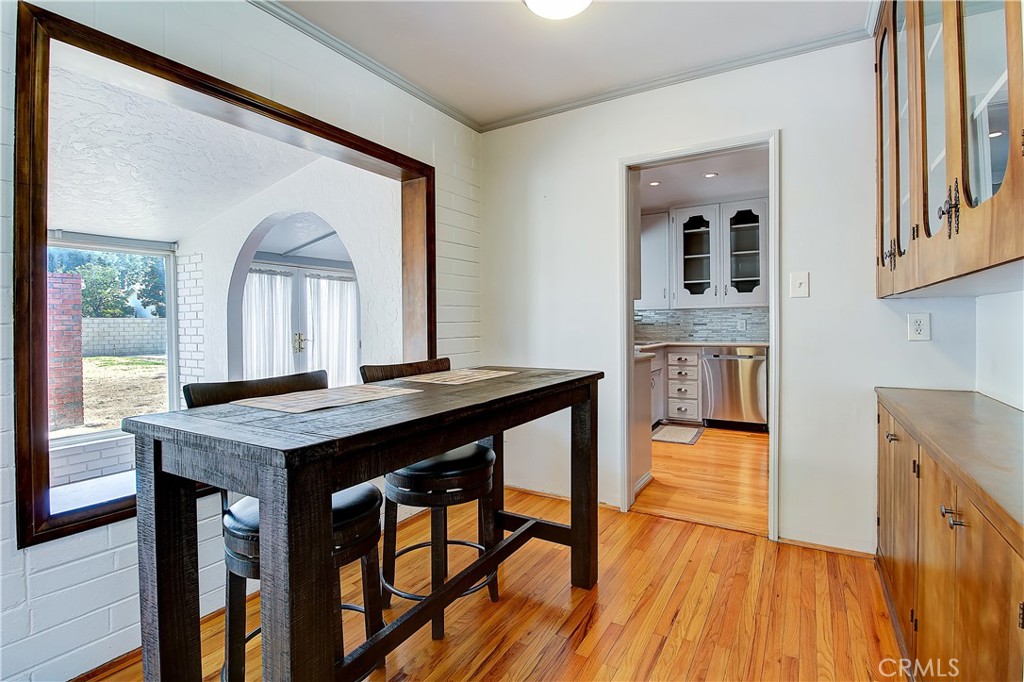 4662 Sierra Street Riverside, CA 92504 - Photo 20 of 41 a view of a kitchen area with furniture and wooden floor