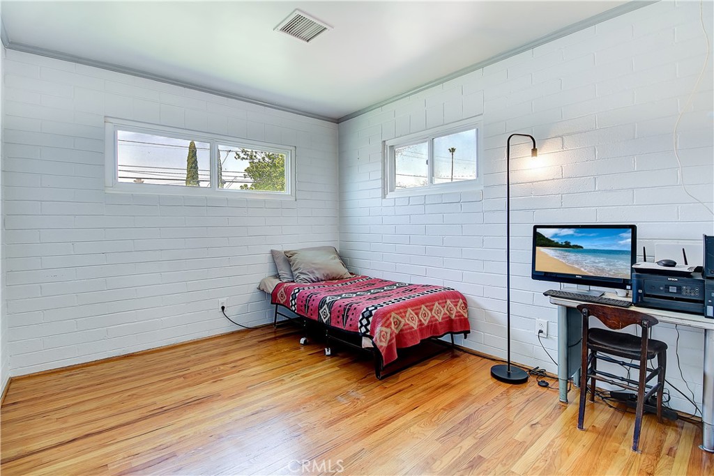 4662 Sierra Street Riverside, CA 92504 - Photo 24 of 41 a living room with furniture and a flat screen tv