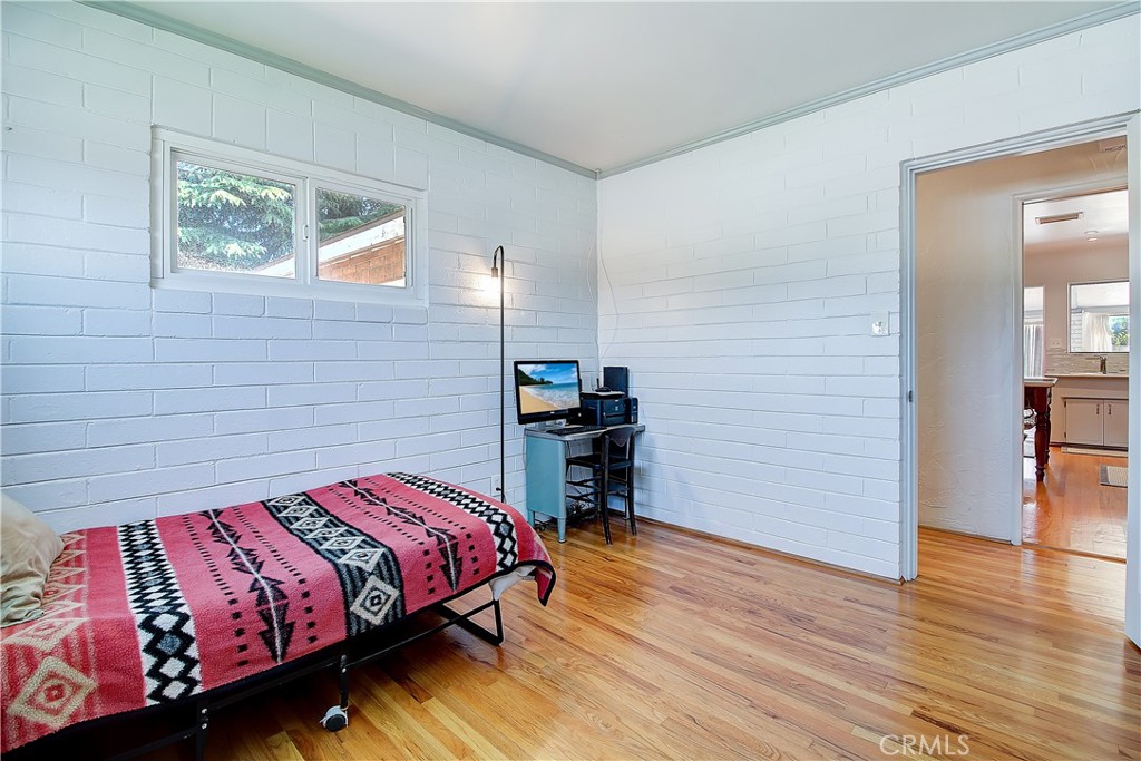 4662 Sierra Street Riverside, CA 92504 - Photo 25 of 41 a bedroom with a bed and a bookshelf