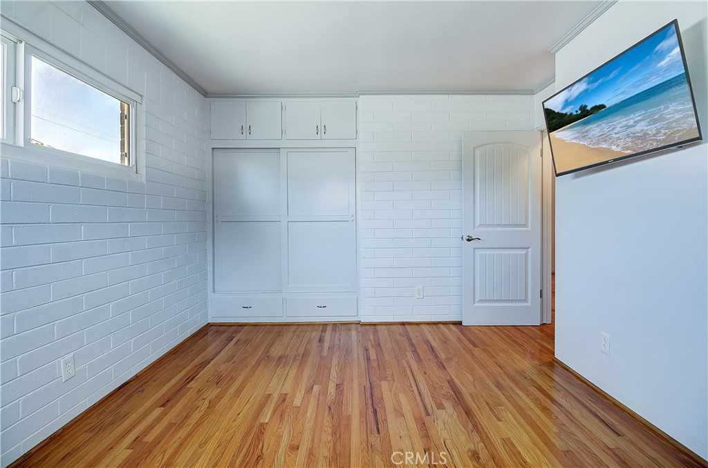 4662 Sierra Street Riverside, CA 92504 - Photo 26 of 41 a view of a room with wooden floor