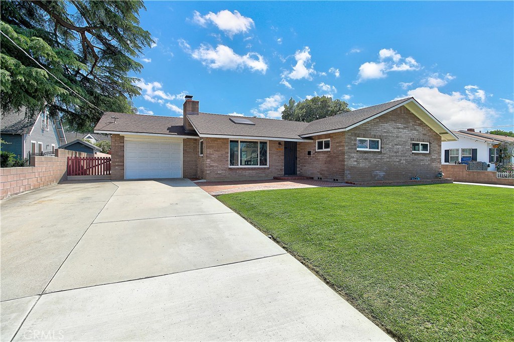 4662 Sierra Street Riverside, CA 92504 - Photo 3 of 41 a front view of house with yard and green space