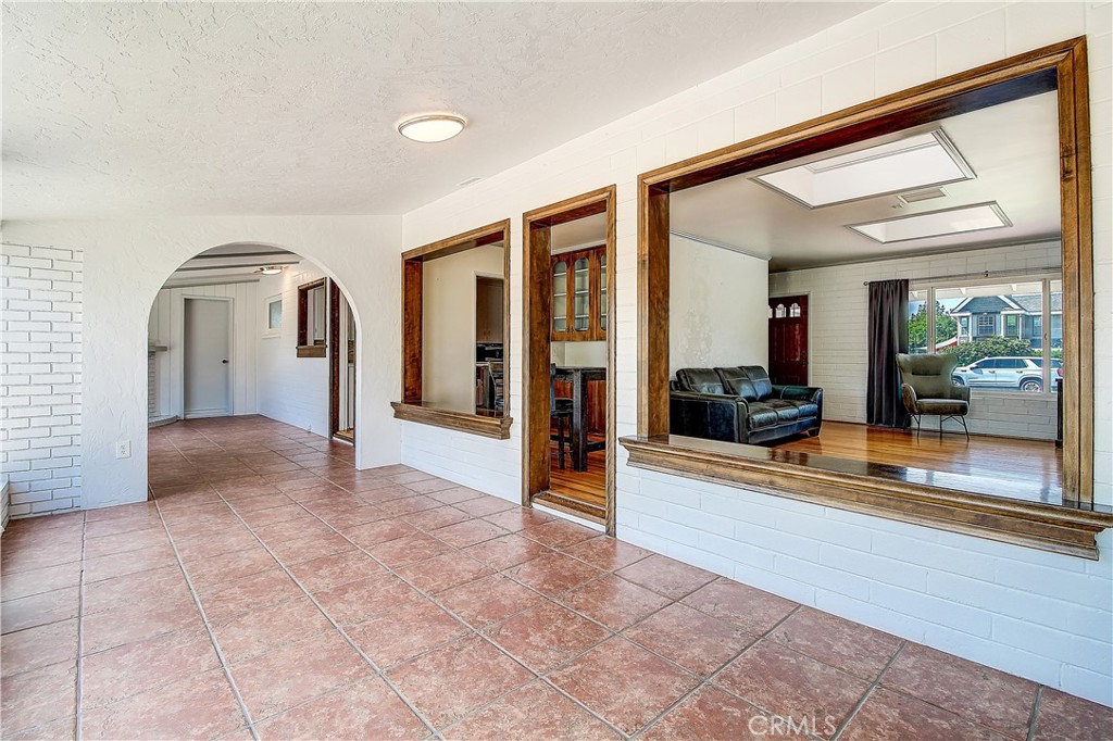 4662 Sierra Street Riverside, CA 92504 - Photo 32 of 41 a view of a hallway with a livingroom and entryway