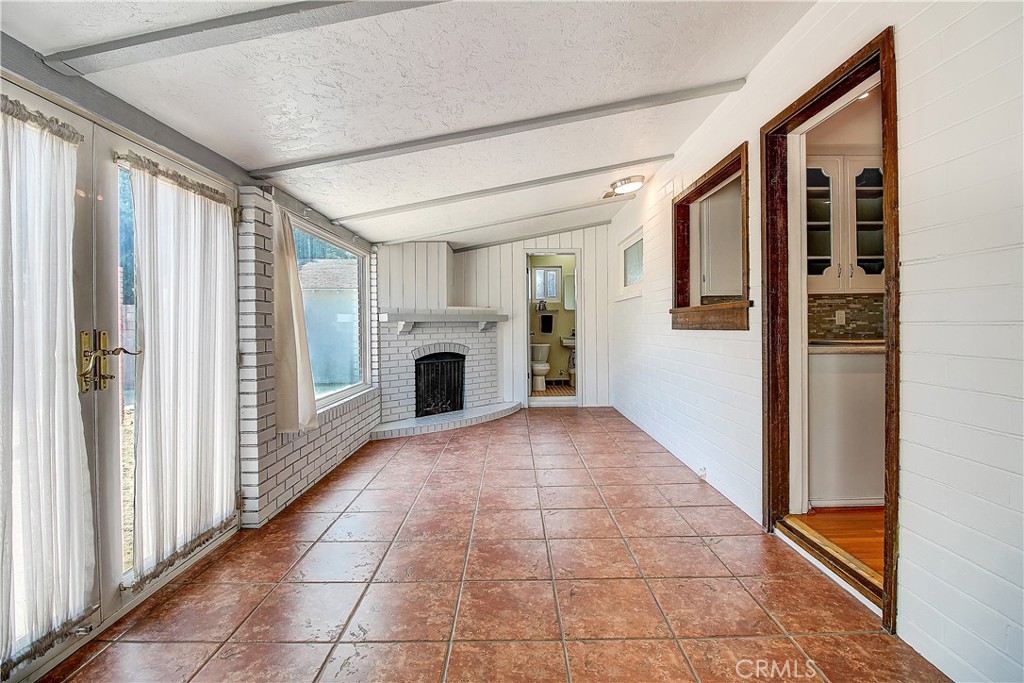4662 Sierra Street Riverside, CA 92504 - Photo 34 of 41 a view of a hallway with furniture and fire place
