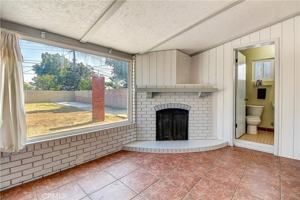 4662 Sierra Street Riverside, CA 92504 - Photo 35 of 41 a view of an empty room with window and fire place