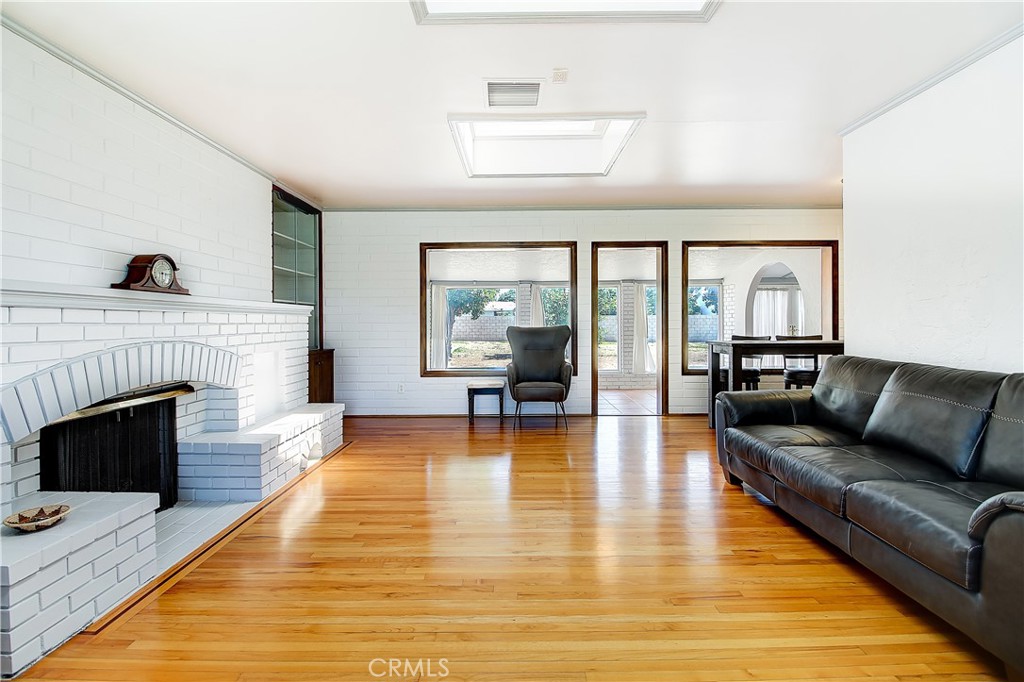 4662 Sierra Street Riverside, CA 92504 - Photo 10 of 41 a living room with furniture and a fireplace