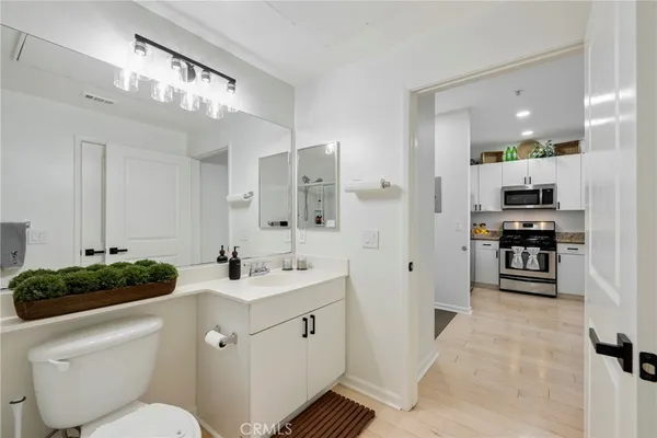 a view of walk in closet with clothes