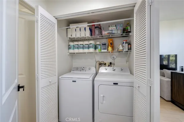 a front view of building with glass windows and iron fence