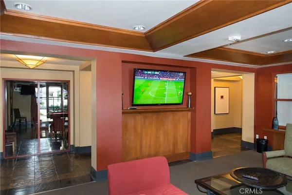 a view of a patio with couches table and chairs and potted plants