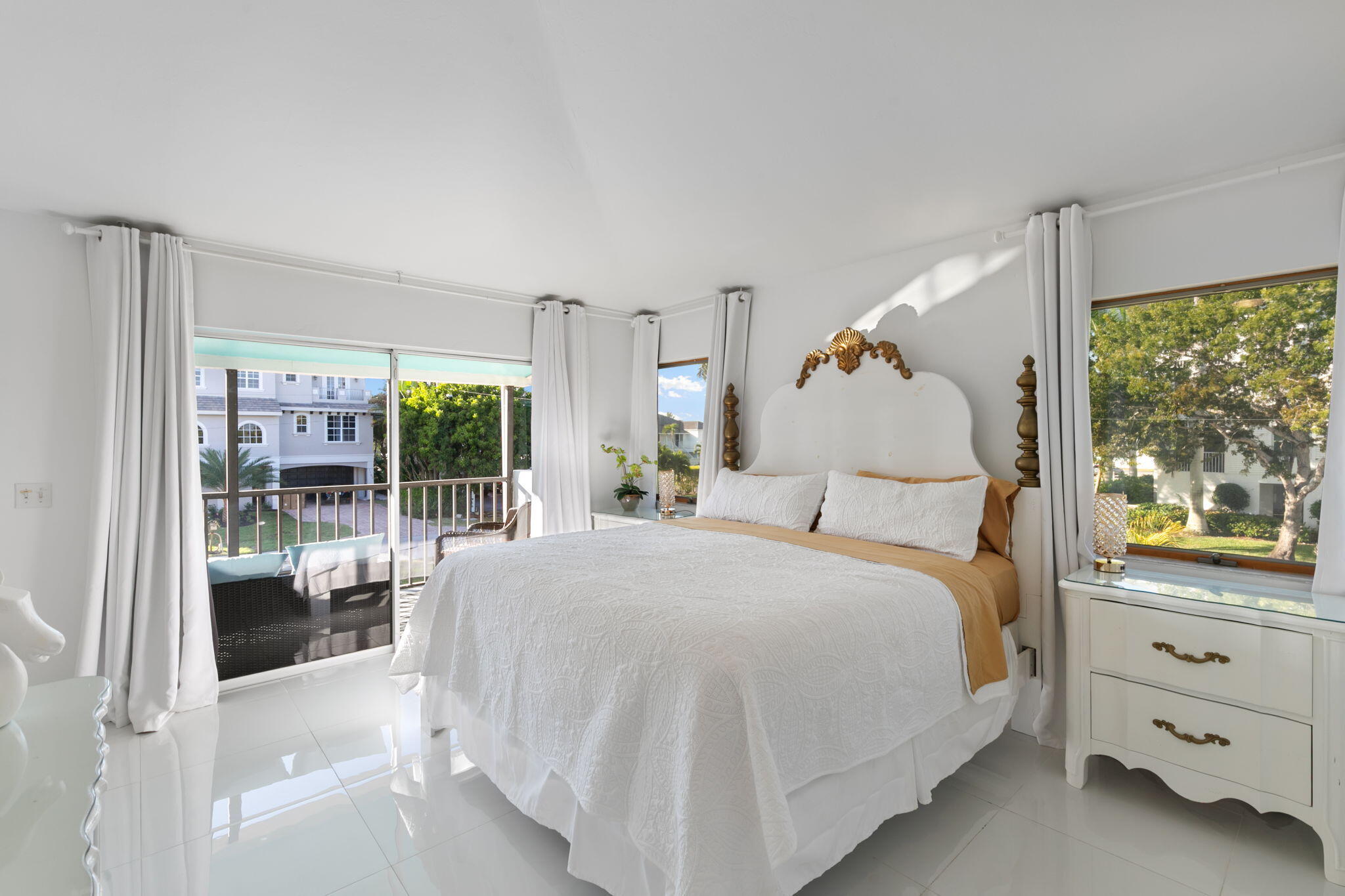 821 Palm Street Marco Island, FL 34145 - Photo 11 of 62 a bedroom with a large bed and a window