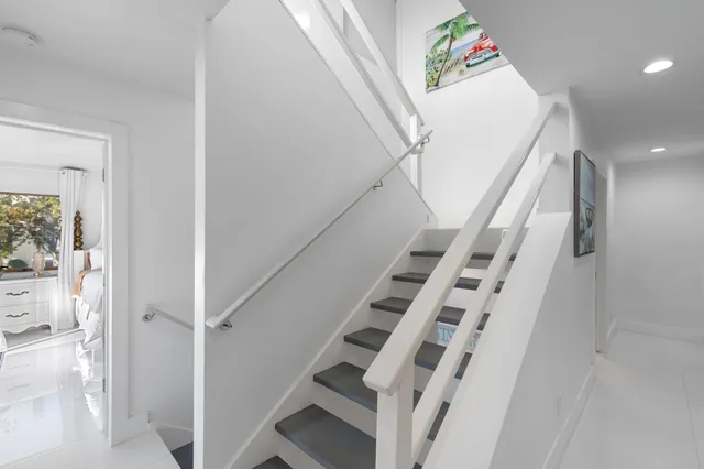 a bedroom with a bed and a lamp